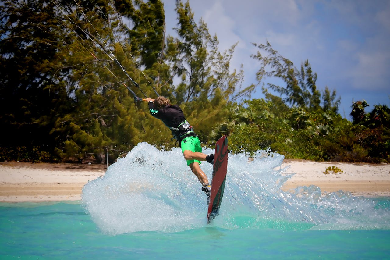 creative-02 Exciting kiteboarding action captured on a vibrant tropical beach, perfect for outdoor sports enthusiasts.