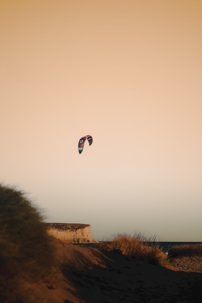 A vibrant kitesurfing scene at Gökçeada, Türkiye during a stunning golden hour.
